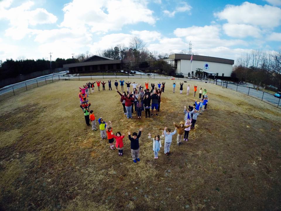 students in the shape of a heart at spirit week